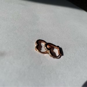 Rose gold heart shaped hoop earrings with stones